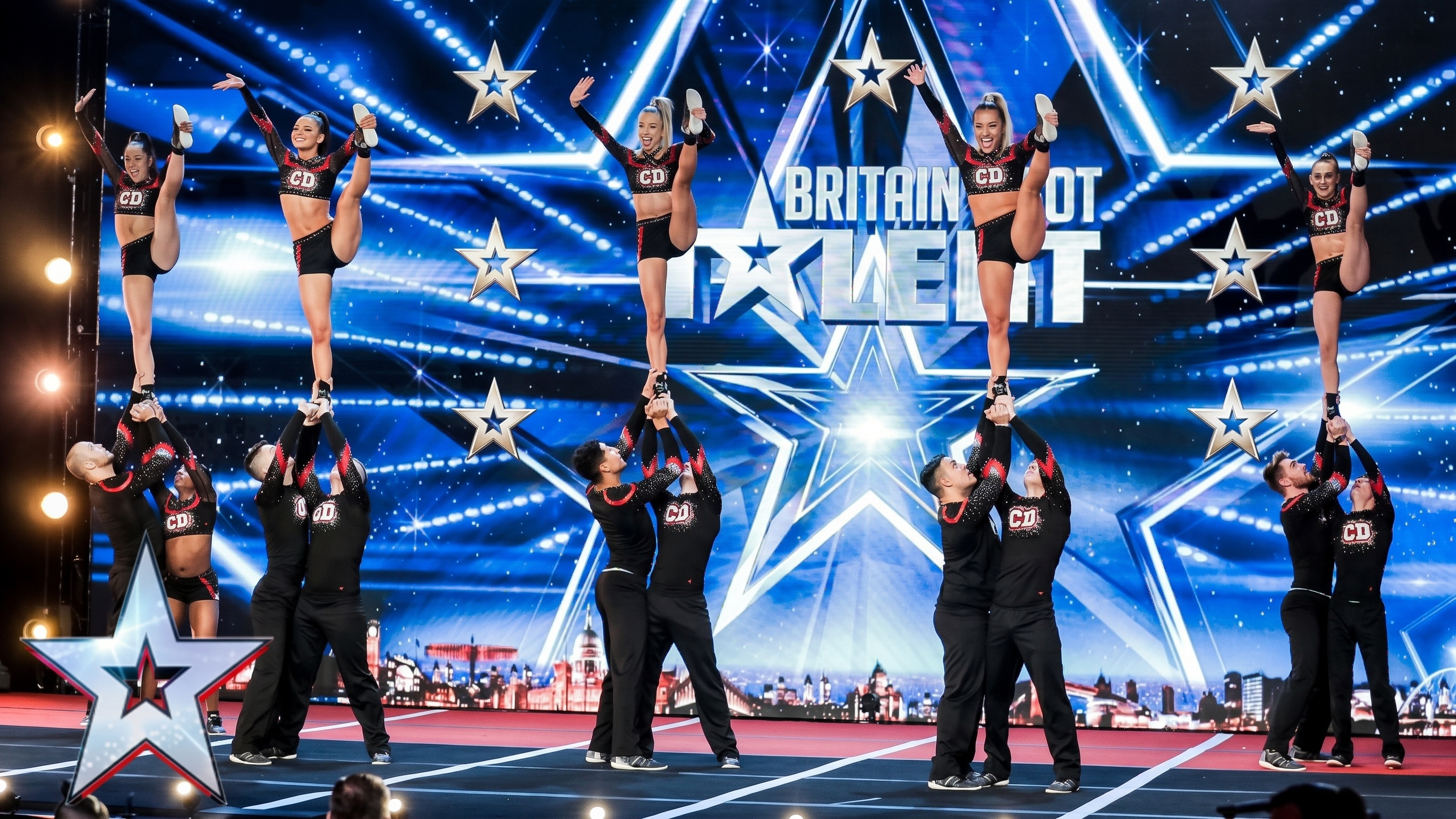 Coventry Dynamite cheerleading team performing on stage